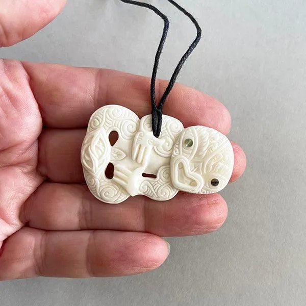 Intricately Carved Cow Bone Maori Tiki Necklace